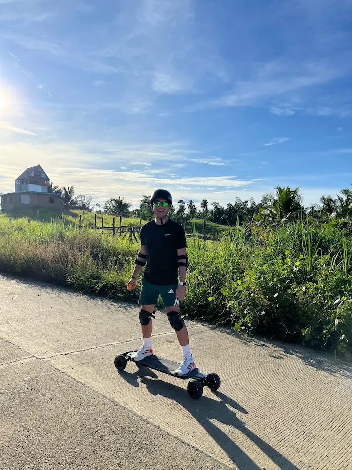 Rider on electric skateboard, Siargao countryside