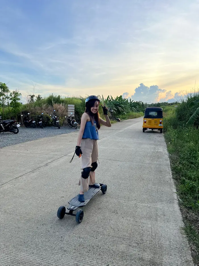 Guest riding eSk8 at sunset, Siargao