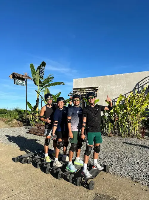 Friends learning electric skateboarding in Siargao